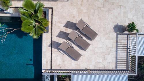 an overhead view of a swimming pool and a building at House of Rogues in Tortola Island