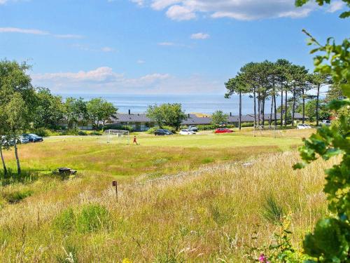 a field with a soccer ball in the grass at Holiday home on a holiday park in Gilleleje in Gilleleje