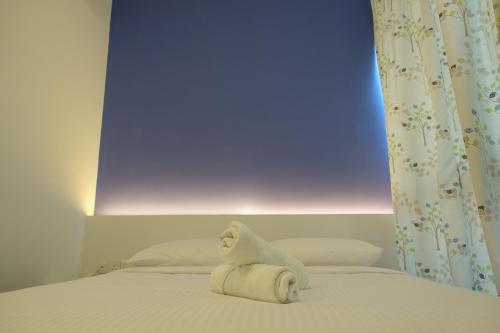 Postel nebo postele na pokoji v ubytování Lodge 10 Hotel