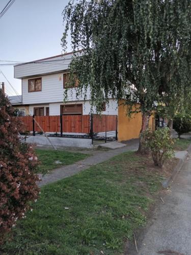 a house with a fence in front of it at Casablanca in Temuco