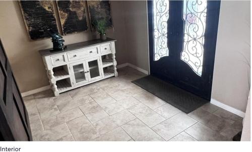 a room with a door and a tiled floor at Best Riverfront Parker Home in Parker