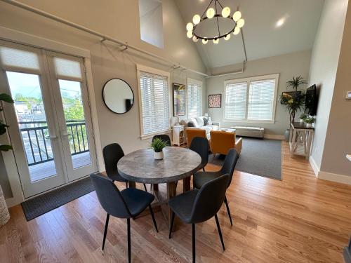 a living room with a table and chairs at Brand New Construction! 3 Unit5 Bed Property in Newport