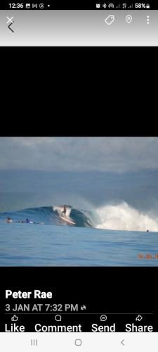 a tv screen with a picture of a mountain in the water at Turtle Campervans Fiji in Singatoka