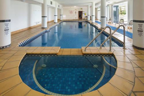 a large swimming pool in a building at Xanadu Escape - Seaside Resort near Surfers Paradise in Gold Coast