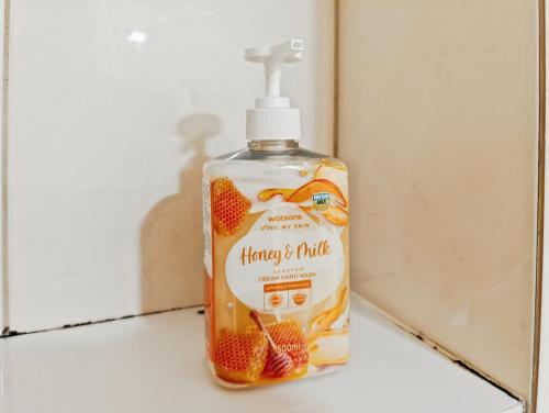 a bottle of strawberryride soap sitting on a counter at Cozy 2BR Springlake Apt Bekasi with Pool & Gym by 2ndHome in Rawabugel