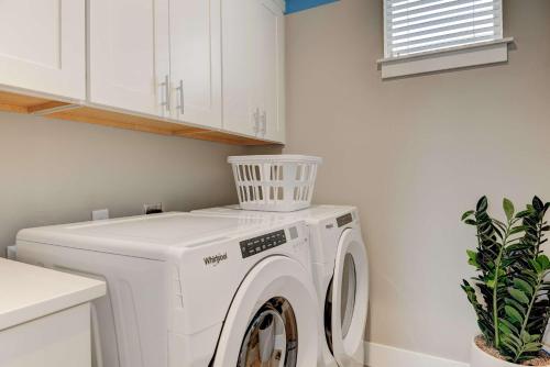 a white washer and dryer in a laundry room at Cozy Montana Getaway Near Bozeman & Yellowstone in Belgrade