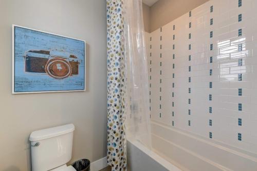 a bathroom with a picture of a camera on the wall at Cozy Montana Getaway Near Bozeman & Yellowstone in Belgrade