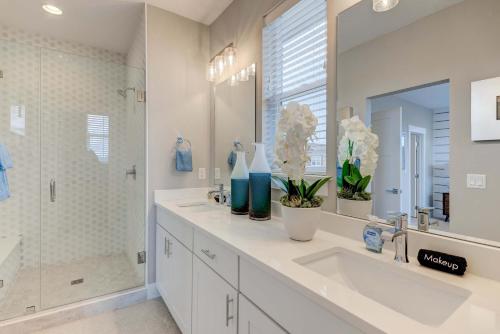 a white bathroom with a sink and a shower at Cozy Montana Getaway Near Bozeman & Yellowstone in Belgrade