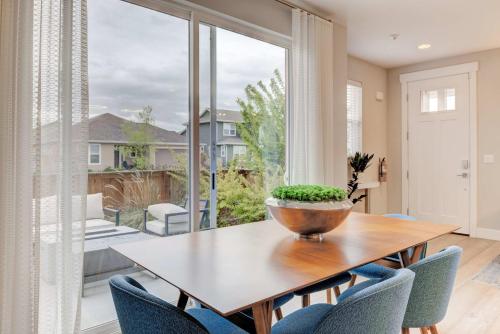 a dining room with a table and chairs and a large window at Cozy Montana Getaway Near Bozeman & Yellowstone in Belgrade