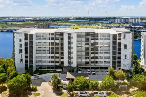 an aerial view of a large apartment building at North Shore Oceanside Kawana in Kawana Waters
