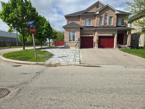 a stop sign in front of a house at Luxury Home in Mississauga in Mississauga