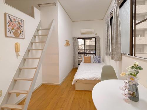 Ένα ή περισσότερα κρεβάτια σε δωμάτιο στο Mori house ookubobiru