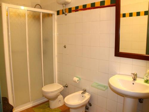 a bathroom with a toilet and a sink at Apartment in Guasticce with shared pool in Guasticce
