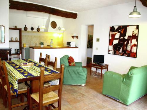 a kitchen and dining room with a table and chairs at Apartment in Guasticce with shared pool in Guasticce