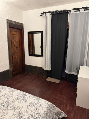 Postel nebo postele na pokoji v ubytování Hacienda bosque