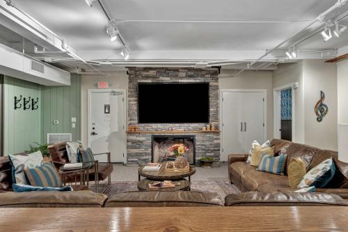 a living room with two couches and a fireplace at Rustic Suite 6BR by Maddox Hotel in Nashville