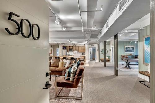 a living room with couches and a table at Rustic Suite 6BR by Maddox Hotel in Nashville
