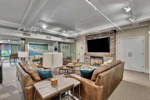 a living room with two couches and a fireplace at Rustic Suite 6BR by Maddox Hotel in Nashville