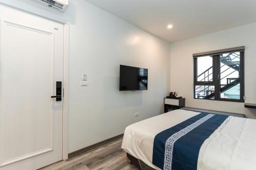 Katil atau katil-katil dalam bilik di Sonavie Hotel Ninh Binh