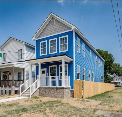 a blue house with a gray roof at Charming 3Bedroom Home in Vibrant Church Hill - Walk to Parks and Dining in Richmond