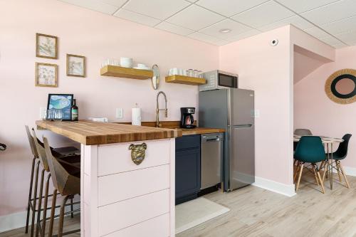 a kitchen with a counter and a refrigerator at Cypress @ Timberline Flats in Traverse City