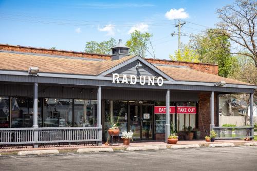 a brick building with a rhod living sign on it at Cypress @ Timberline Flats in Traverse City