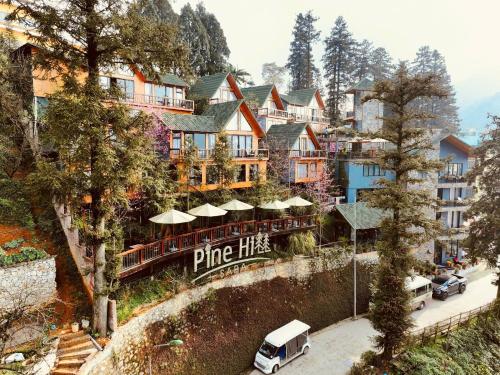 a hotel with a sign that reads pine hills at Sapa Pine Hill Eco Lodge in Sa Pa