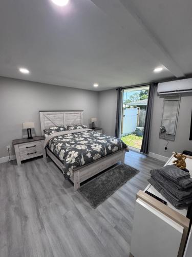 a bedroom with a bed and a large window at Vista Beach in Clearwater