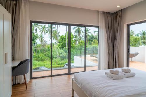 Postel nebo postele na pokoji v ubytování Villa Yin 2BR Cosy Oasis with a Private Pool