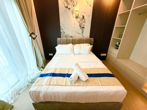 Ένα ή περισσότερα κρεβάτια σε δωμάτιο στο Bay Premier Suites by SSVC