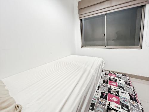 Postel nebo postele na pokoji v ubytování House PIK2 Cluster Virginia 2BR with Wi-Fi & Netflix