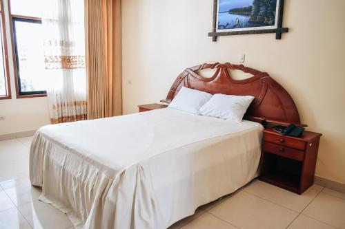 Ένα ή περισσότερα κρεβάτια σε δωμάτιο στο Hotel Sol del Oriente Pucallpa