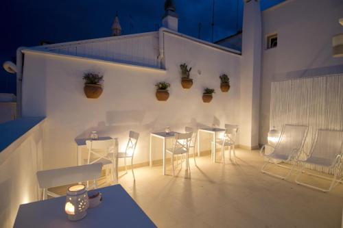 a room filled with furniture and lights at Casa Perugini in Monopoli