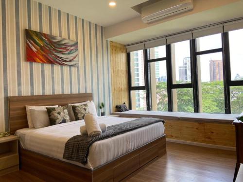 Ένα ή περισσότερα κρεβάτια σε δωμάτιο στο Ceylonz Suites By Staybliss