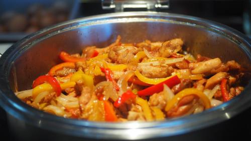 a pot full of food with meat and vegetables at Atour S Hotel Shenzhen Luohu Shuibei in Shenzhen