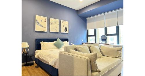 Ένα ή περισσότερα κρεβάτια σε δωμάτιο στο Ceylonz Suites By Staybliss