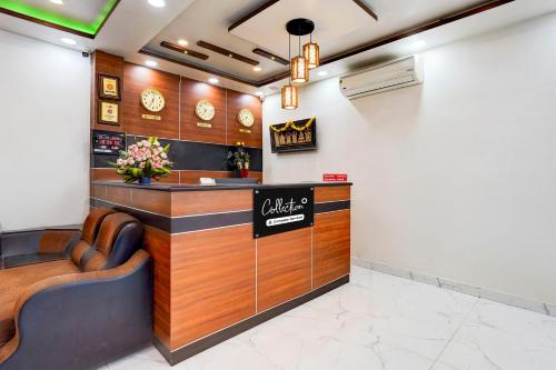 a restaurant with a counter with a calzone sign on it at Super Collection O Tirumala Road Near Alipiri in Tirupati