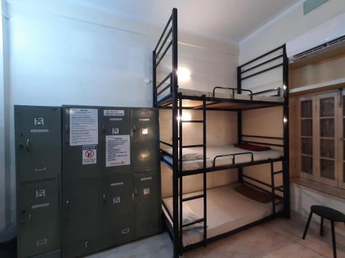 a room with two bunk beds and two lockers at Bubble Beds in Kolkata