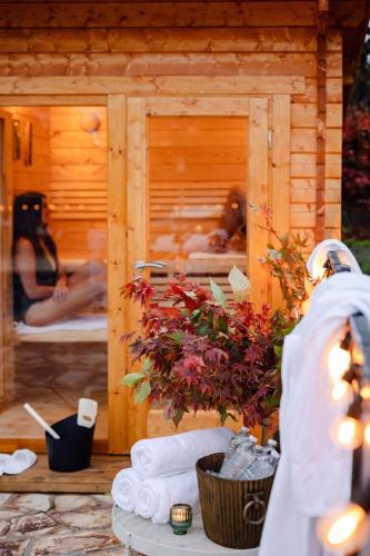 a group of people in a sauna in a wooden cabin at The Oriana Orange - Retro Hotel & Resort in Orange