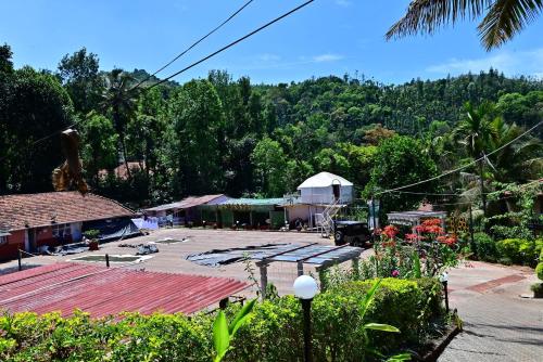 a view of a town with trees in the background at Aayana Valley in Chikmagalur