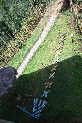 an aerial view of a field with tables and chairs at Aayana Valley in Chikmagalur