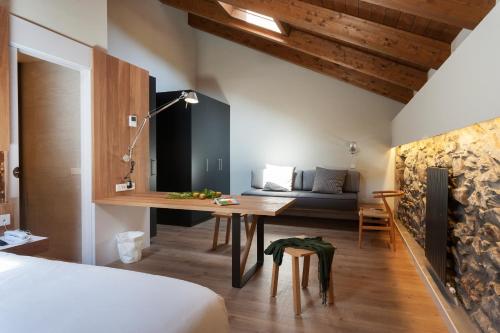 a room with a desk and a bed and a couch at Palacio de Yrisarri by IrriSarri Land in Igantzi