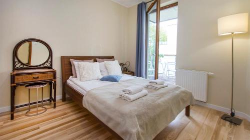 Ένα ή περισσότερα κρεβάτια σε δωμάτιο στο Nadmorski Rentyear Apartments