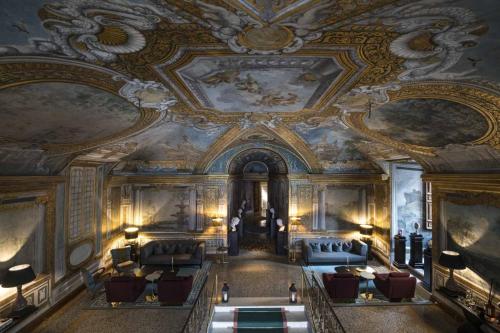 an ornate room with couches and a ceiling at Palazzo Shedir - The Leading Hotels of the World in Rome