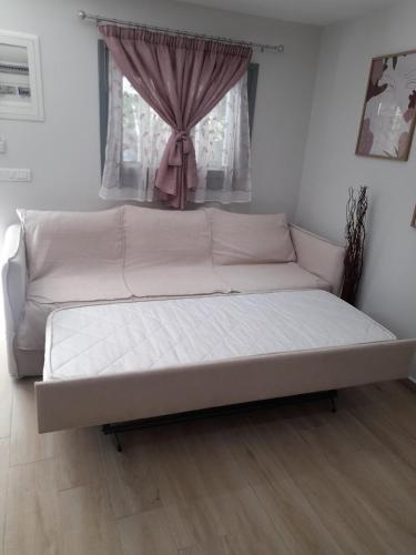 Ένα ή περισσότερα κρεβάτια σε δωμάτιο στο Evas Home
