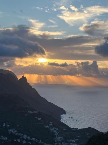 a view of the sun setting over the ocean at Apartamento torres in Santa Cruz de Tenerife