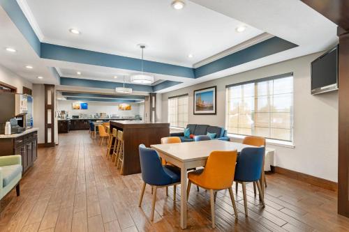 an office lobby with a table and chairs at Comfort Inn & Suites Sacramento - University Area in Sacramento
