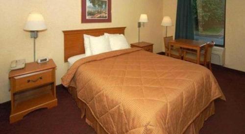 Ένα ή περισσότερα κρεβάτια σε δωμάτιο στο Quality Inn
