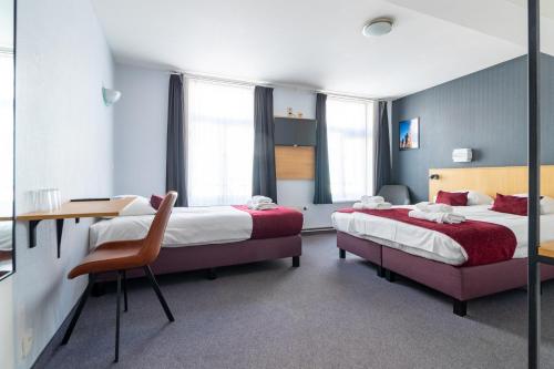 Postel nebo postele na pokoji v ubytování Hotel Montovani