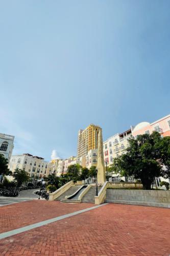 a monument in the middle of a city with buildings at Moonlight Hotel Phu Quoc in Phu Quoc